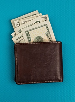Wallet of money for cost of cosmetic dentistry in Topeka & Silver Lake