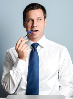 Man chewing on a pen