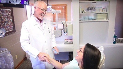 dentist shaking patient's hand