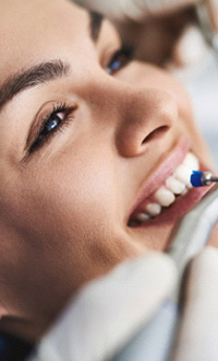 Woman having her teeth cleaned