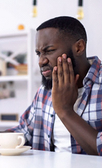 Man with sensitive tooth