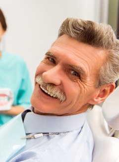 A senior man getting dentures