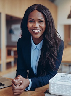 Woman smiling after cosmetic dentistry in Topeka & Silver Lake