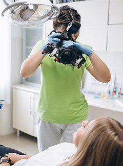 assistant taking patient pictures