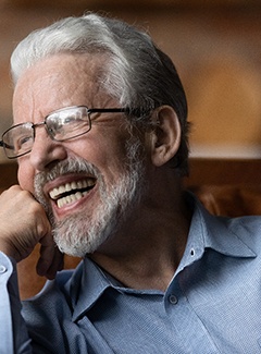 Man laughing in chair