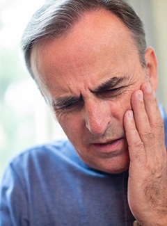 Man with toothache in Topeka Silver Lake should visit his dentist