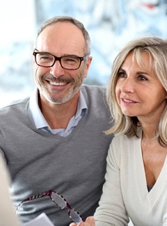 couple at a consultation for implant dentures