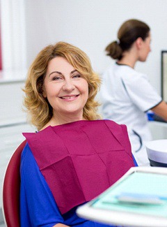 Woman smiles after getting dental implants in Silver Lake