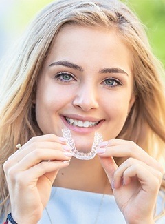 woman trying on invisalign