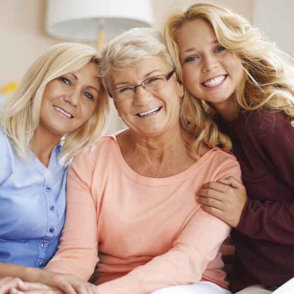 smiling mother, daughter, and grandmother