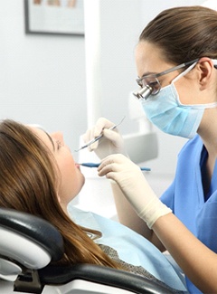 A young female patient in the dentist chair