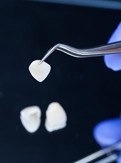 veneer in metal clamp