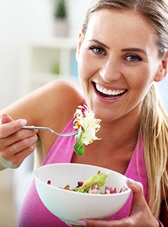 Woman eats salad in Topeka & Silver Lake