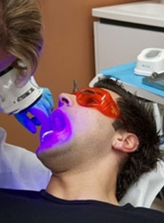 man getting oral cancer screening