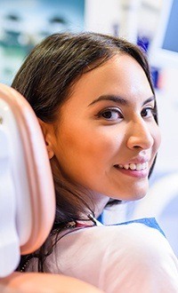 woman smiling over shoulder