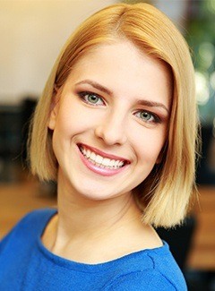 woman in blue smiling