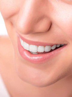 patient smiling after teeth whitening in Topeka and Silver Lake