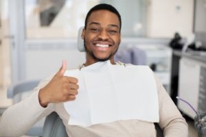 Man smiling after his veneer placement